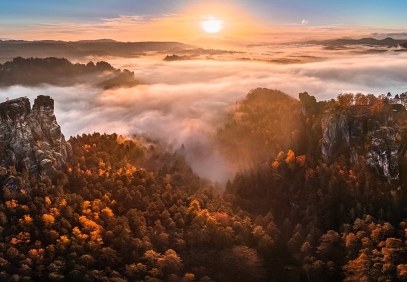 a foggy sunrise over a mountain range