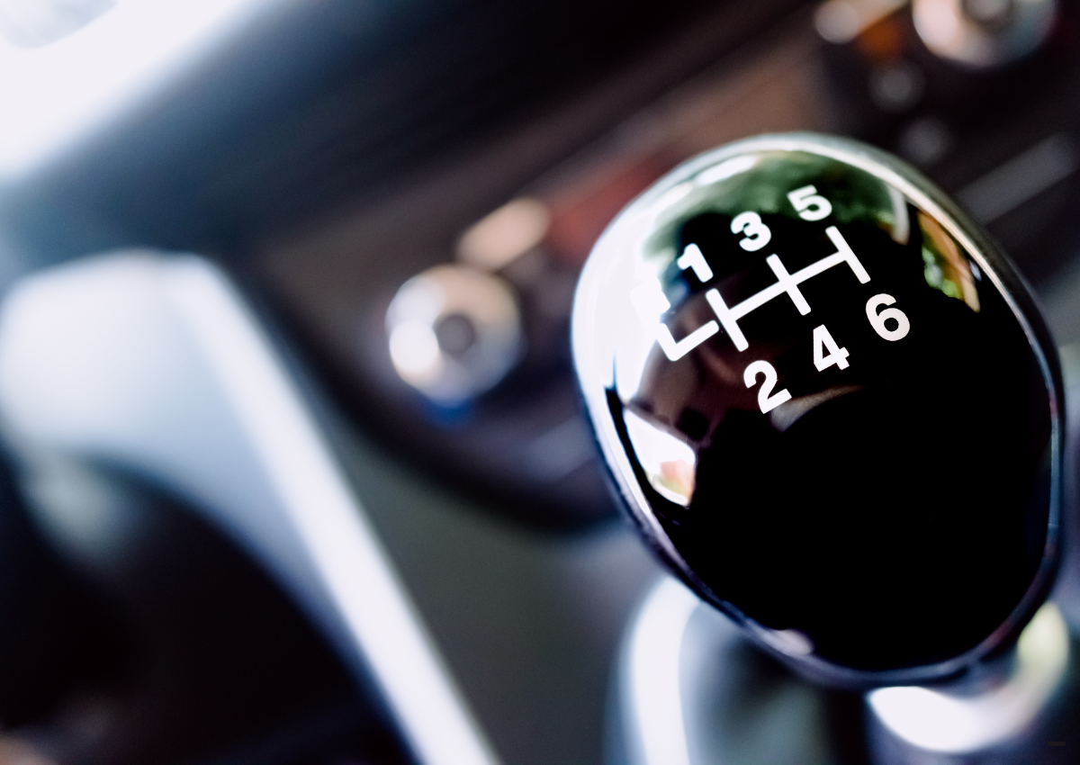 close up of a shiny gear stick implying moving up a gear